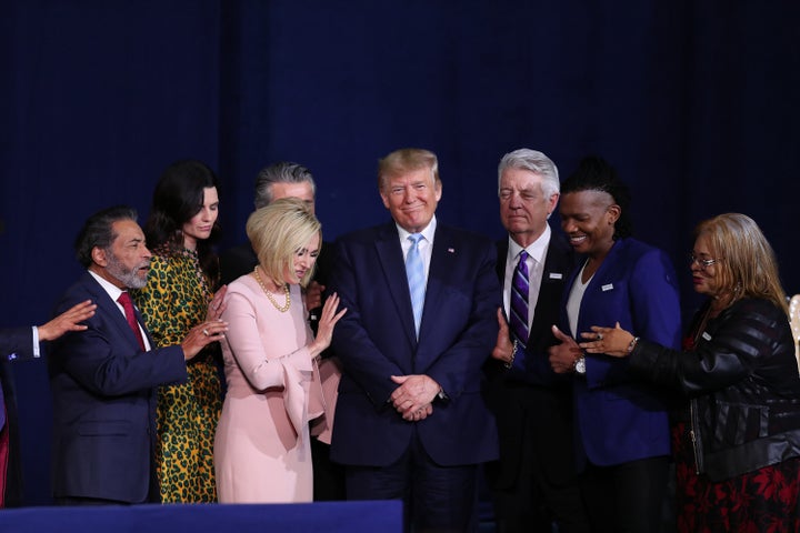 Faith leaders pray over President Donald Trump during a 'Evangelicals for Trump' campaign event held at the King Jesus International Ministry on January 3, 2020 in Miami, Florida.